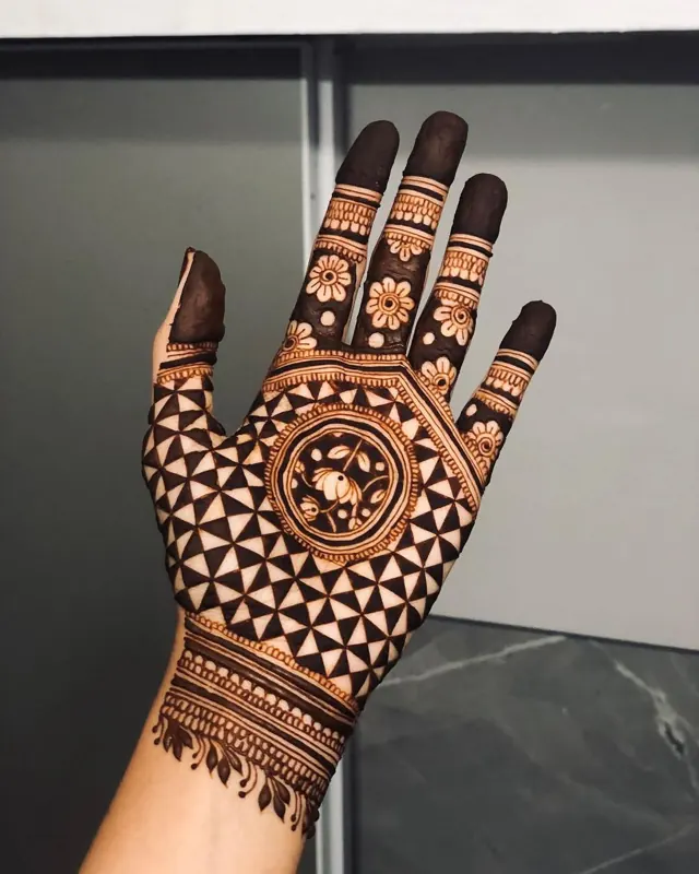 Elegant Arabic and floral mehendi design on hands by Anand Mehendi & Tattoo, Bhubaneswar