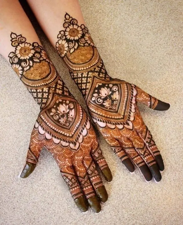 Elegant Arabic and floral mehendi design on hands by Anand Mehendi & Tattoo, Bhubaneswar