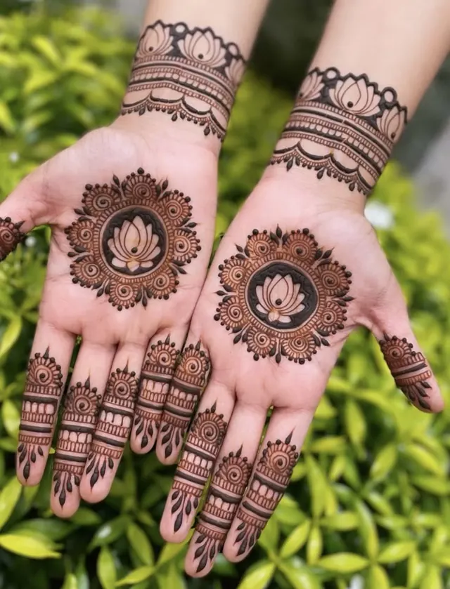Elegant Arabic and floral mehendi design on hands by Anand Mehendi & Tattoo, Bhubaneswar