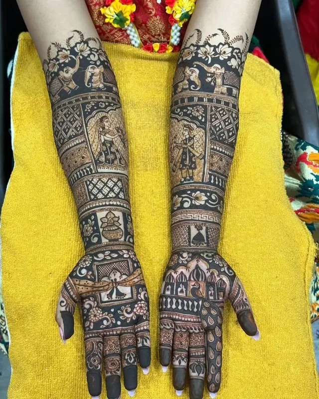 Detailed bridal mehendi design on both arms by Anand Mehendi & Tattoo, Bhubaneswar