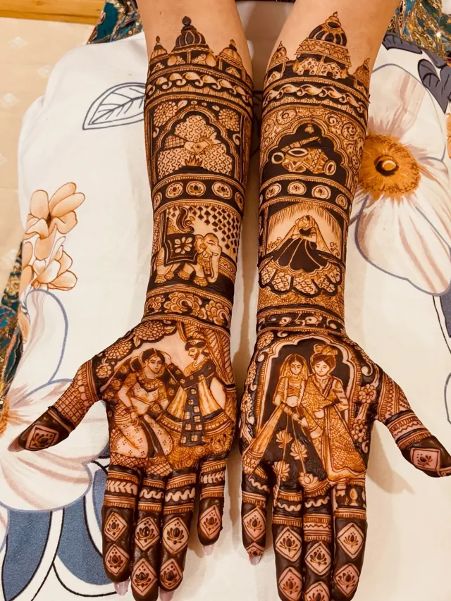 Detailed bridal mehendi design on both arms by Anand Mehendi & Tattoo, Bhubaneswar