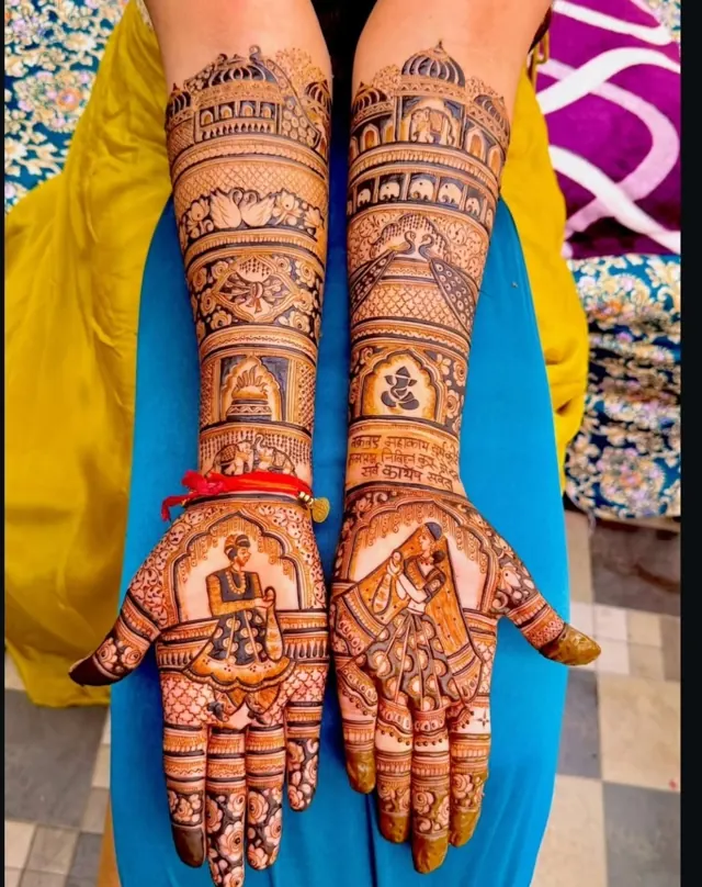 Detailed bridal mehendi design on both arms by Anand Mehendi & Tattoo, Bhubaneswar