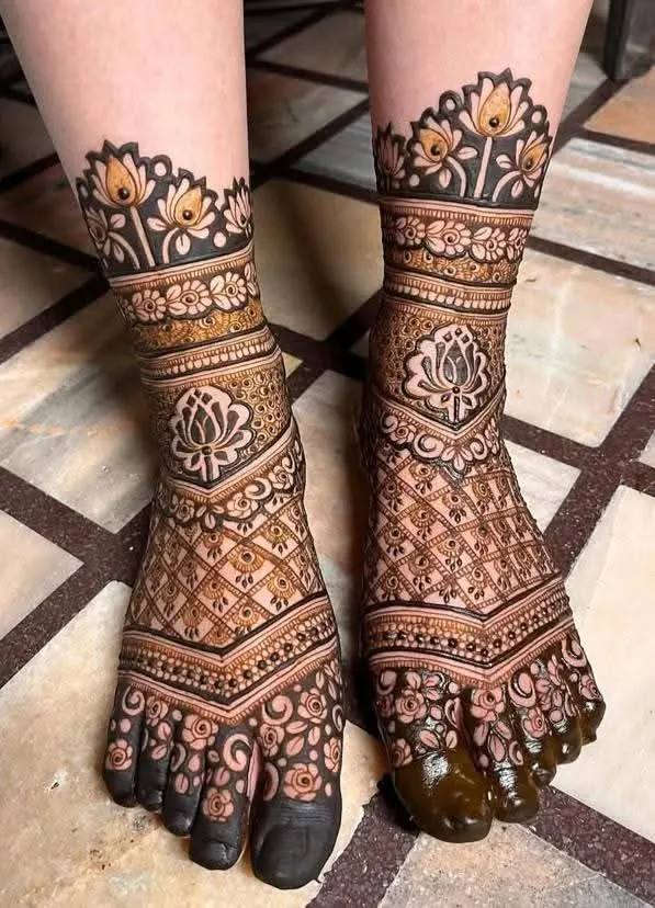 Bridal mehendi design on feet by Anand Mehendi & Tattoo, Bhubaneswar